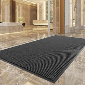 100pointONE durable front door mat with low-profile thickness under a doorway