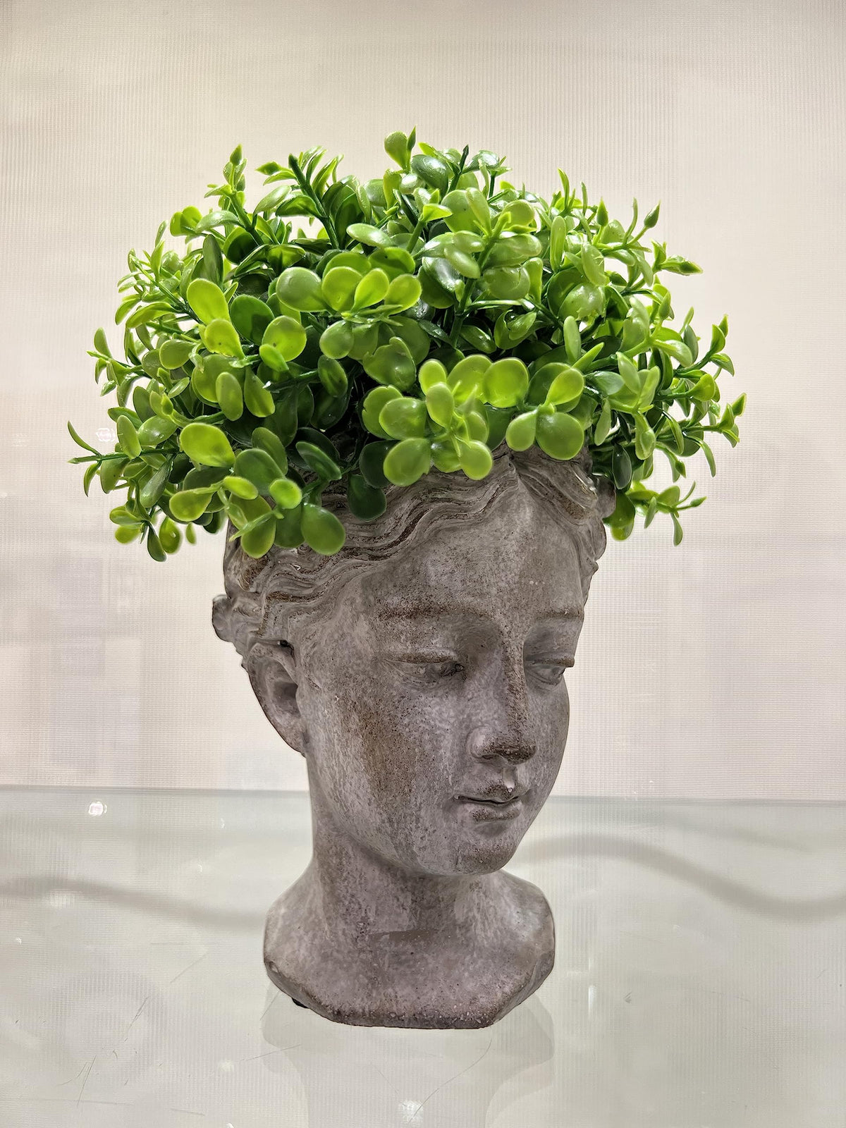 Abbott Collection Goddess Head Planter grey with succulent display, elegant centerpiece.
