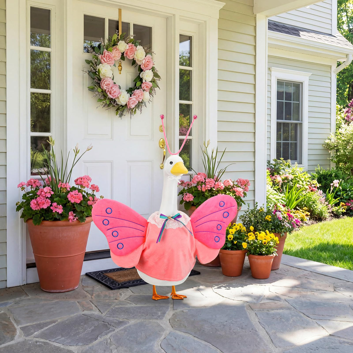 Abbylike weatherproof goose costume protecting statue from rain and sun