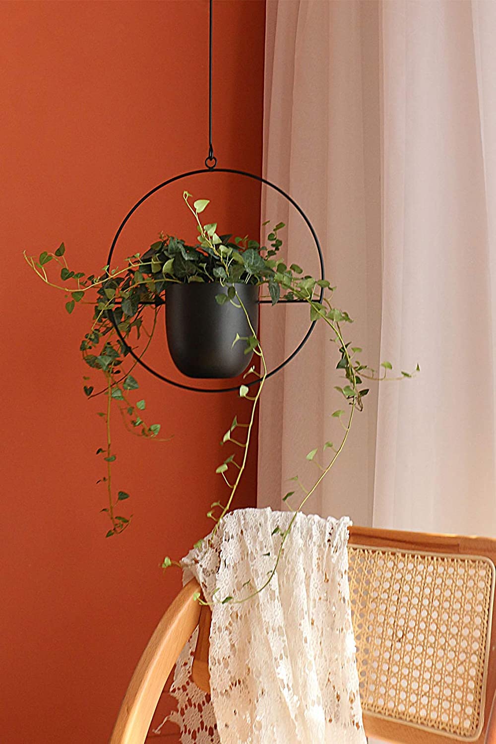 Detail showing absence of drainage holes in pots for moisture control.