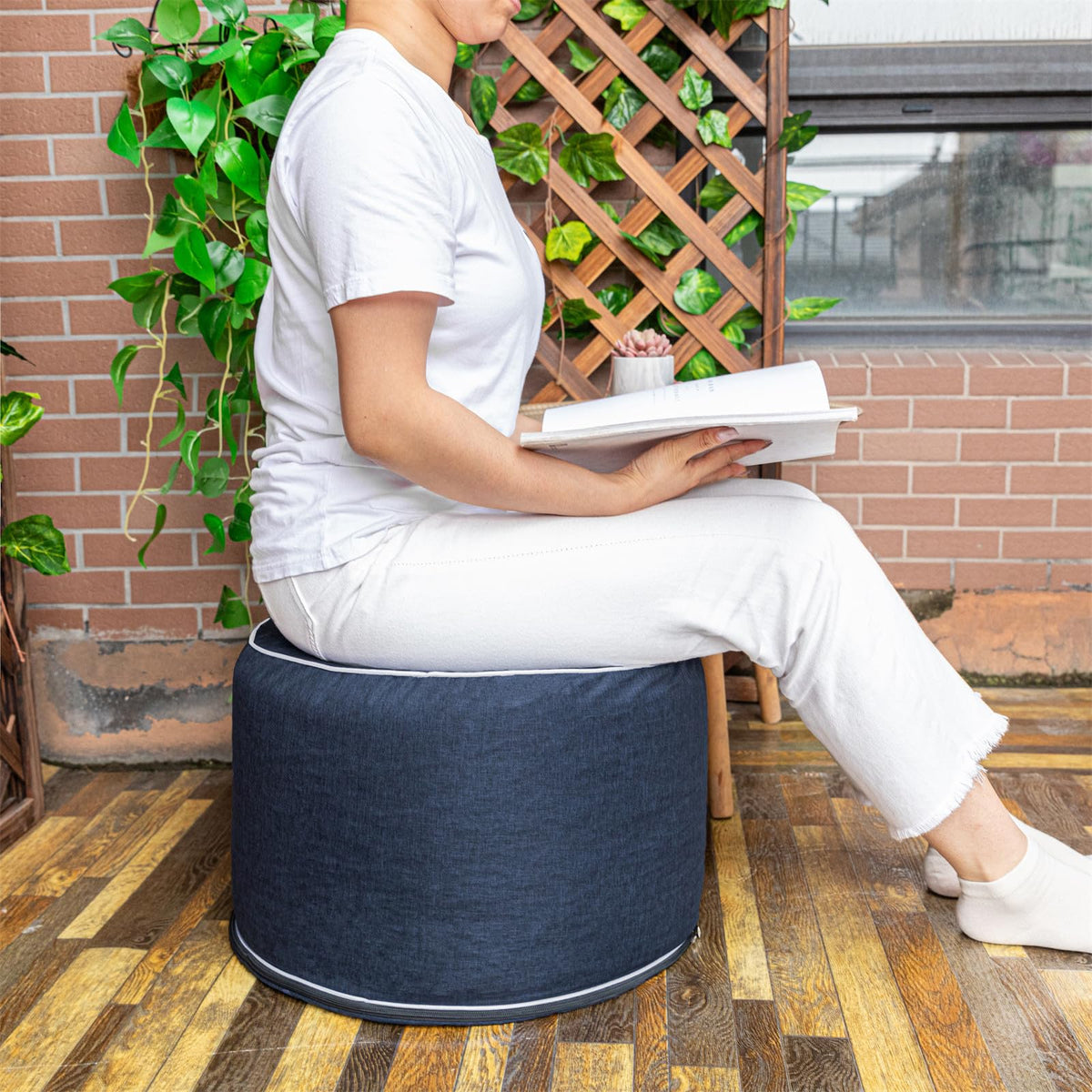 Navy blue AbunHeri ottoman adds color while staying weather-ready.