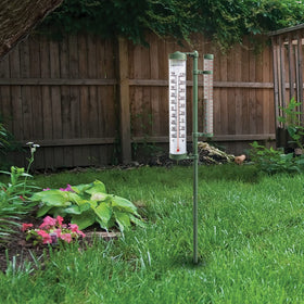 Acurite 02345 42-inch stand stabilizes the gauge in a garden setting.