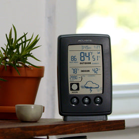 AcuRite wireless outdoor sensor with hanger for easy mounting in the yard or on a fence.