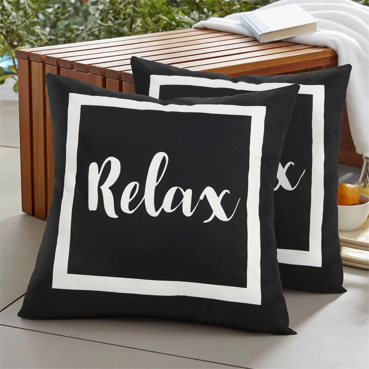 Adabana outdoor pillow cover in black and white with waterproof fabric for patio surfaces.