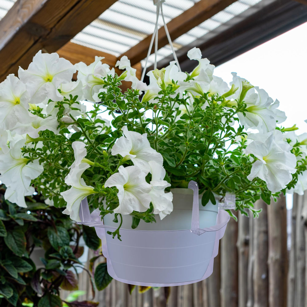 Adnee textured bottom hanging tray stabilizes pots and prevents moisture buildup.