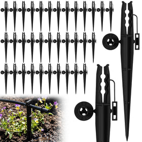 Afarnook 50pcs irrigation stakes arranged for a neat garden irrigation system.