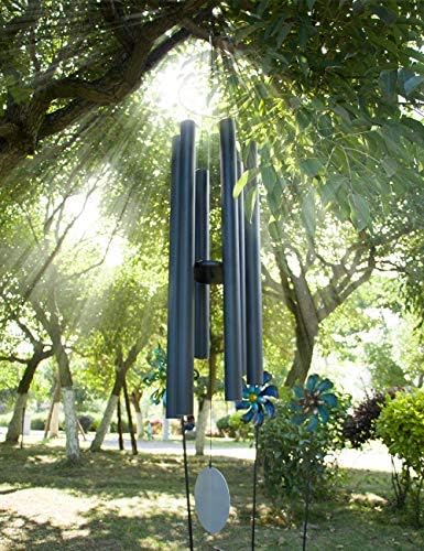 Afirst deep-tone wind chimes in a garden, creating relaxing melodies.