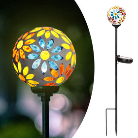 Afirst solar gazing ball mosaic lights the garden at night