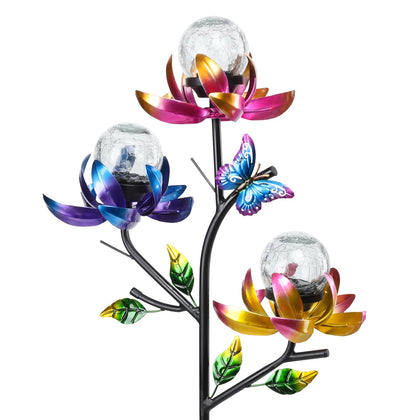 Afirst solar lotus flowers wind spinner displaying colorful daytime motion in the garden