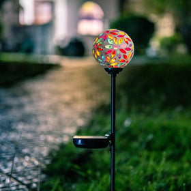 Afirst mosaic ball adds ambient color to patios and lawns.