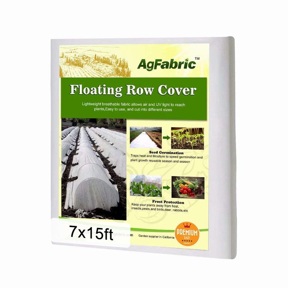 Agfabric plant cover in 7x15 ft laid over garden beds for frost protection