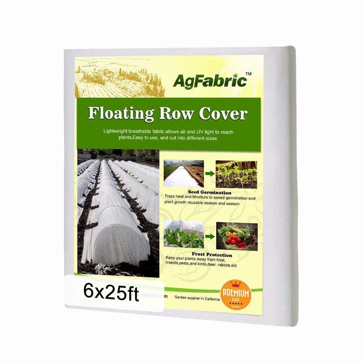 Agfabric plant cover over tomato rows protects from frost while allowing airflow.