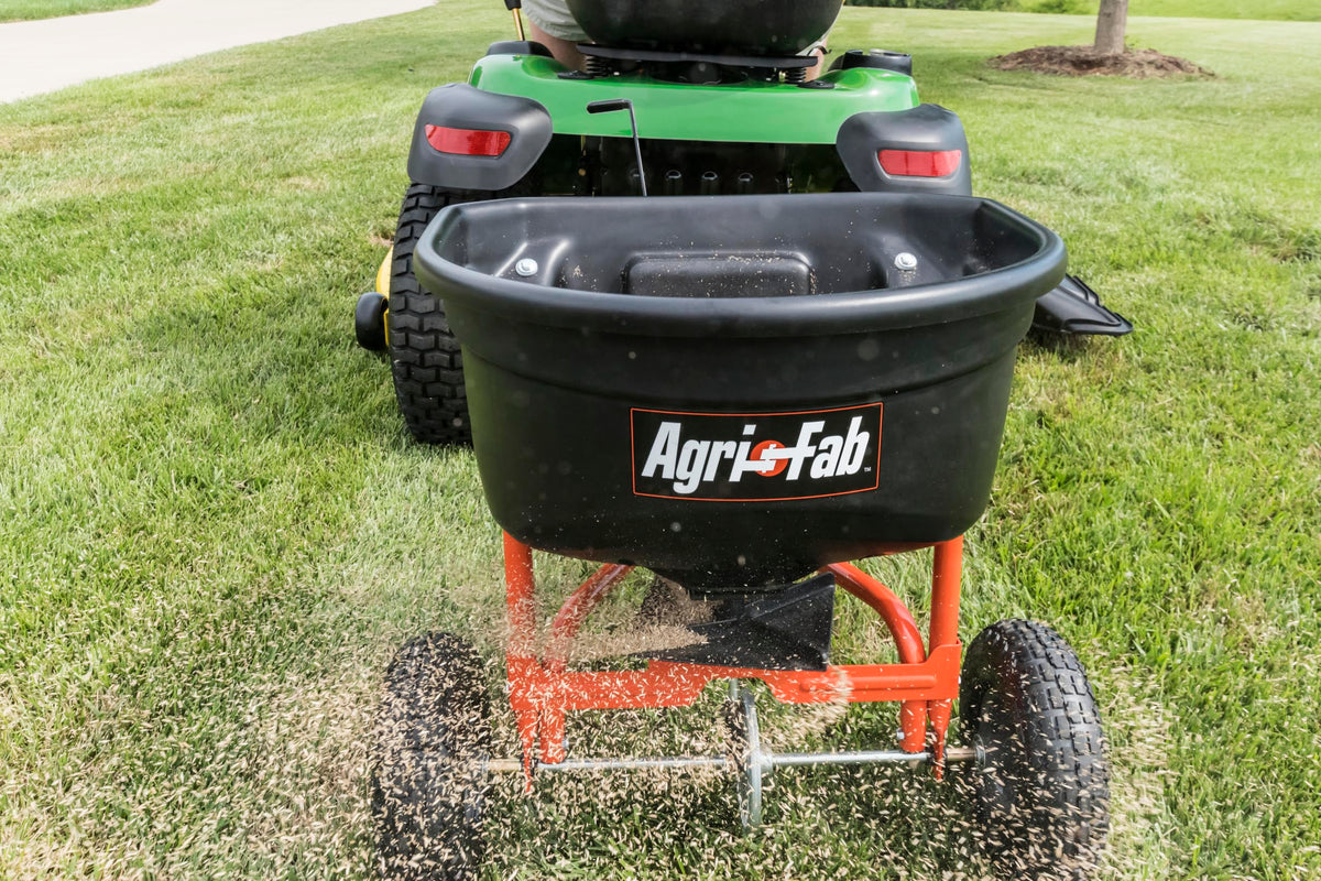Universal hitch fits most lawn tractors for easy tow behind spreading.