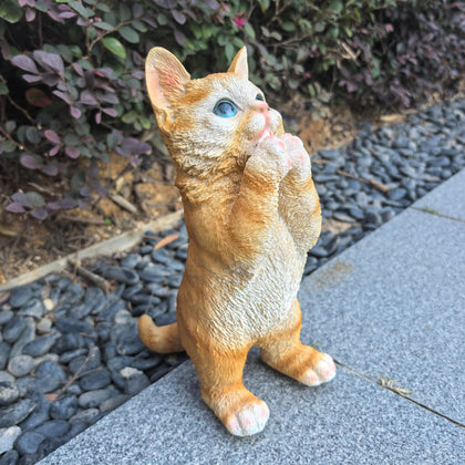 Ahbuohe garden cat statue, front view, adds playful charm to outdoor spaces.