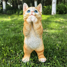 Ahbuohe garden cat statue, on flower bed, enhances curb appeal.