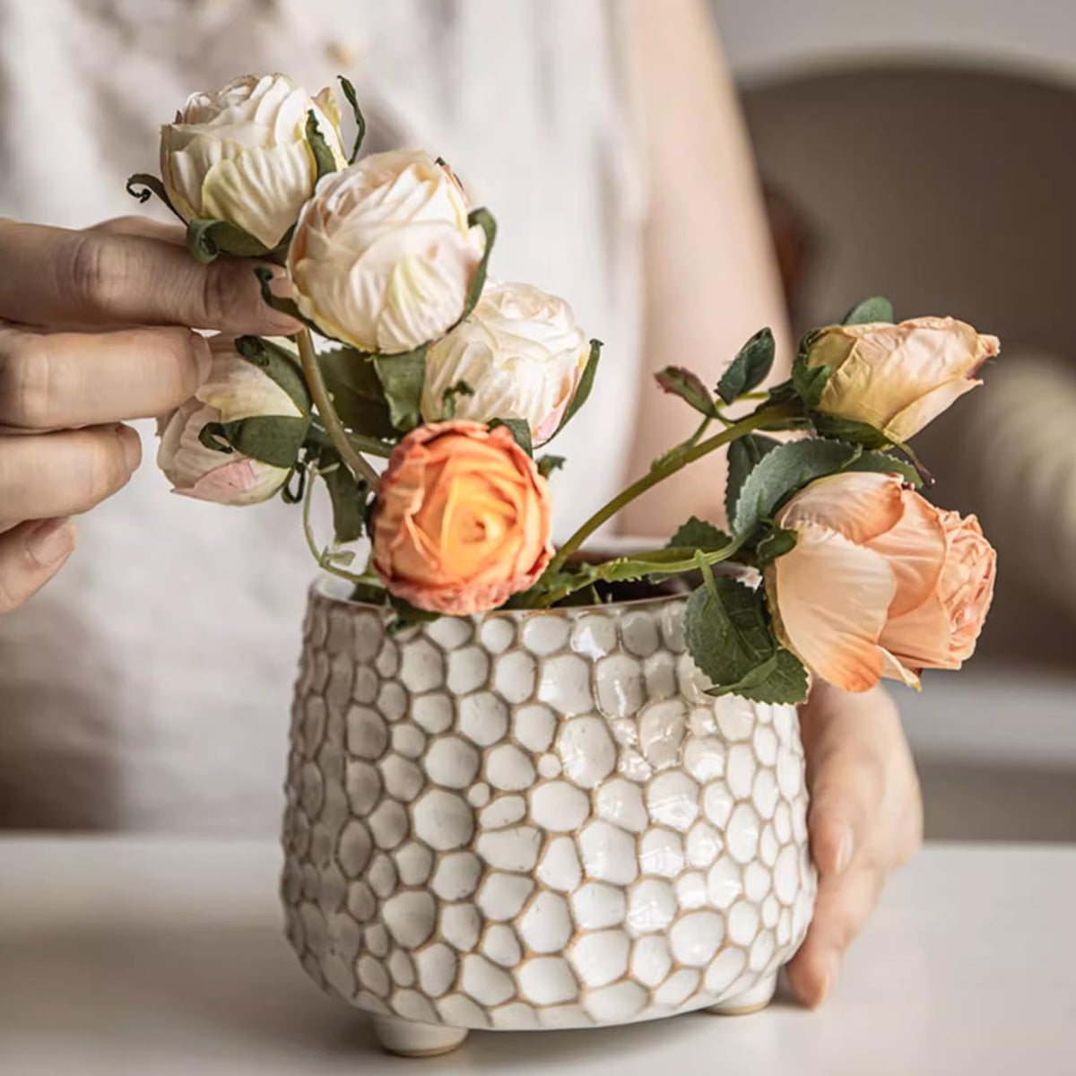 No drainage hole Alikexin planter as a decorative cache pot for small plants.