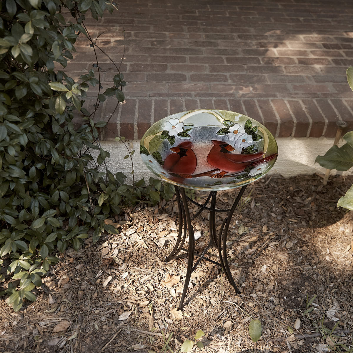 Alpine birdbath creates a charming backyard gathering spot for birds.