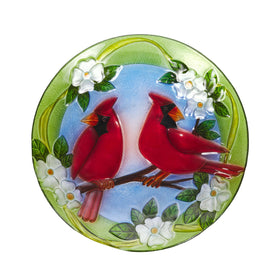 Alpine birdbath with cardinal floral design adds color to your garden.