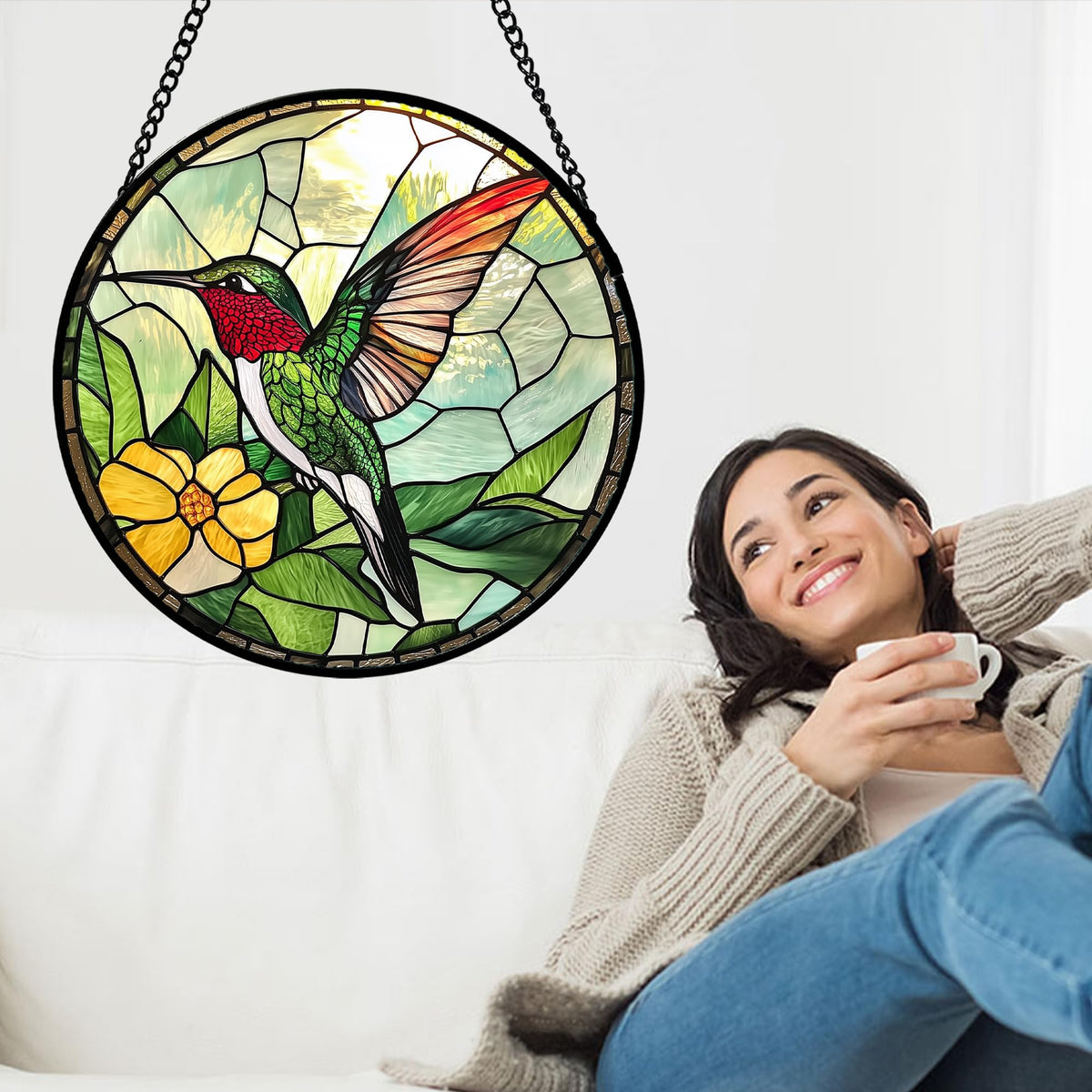 AMDERVEN close-up of the green hummingbird sun catcher reveals intricate glass details for decorative appeal.