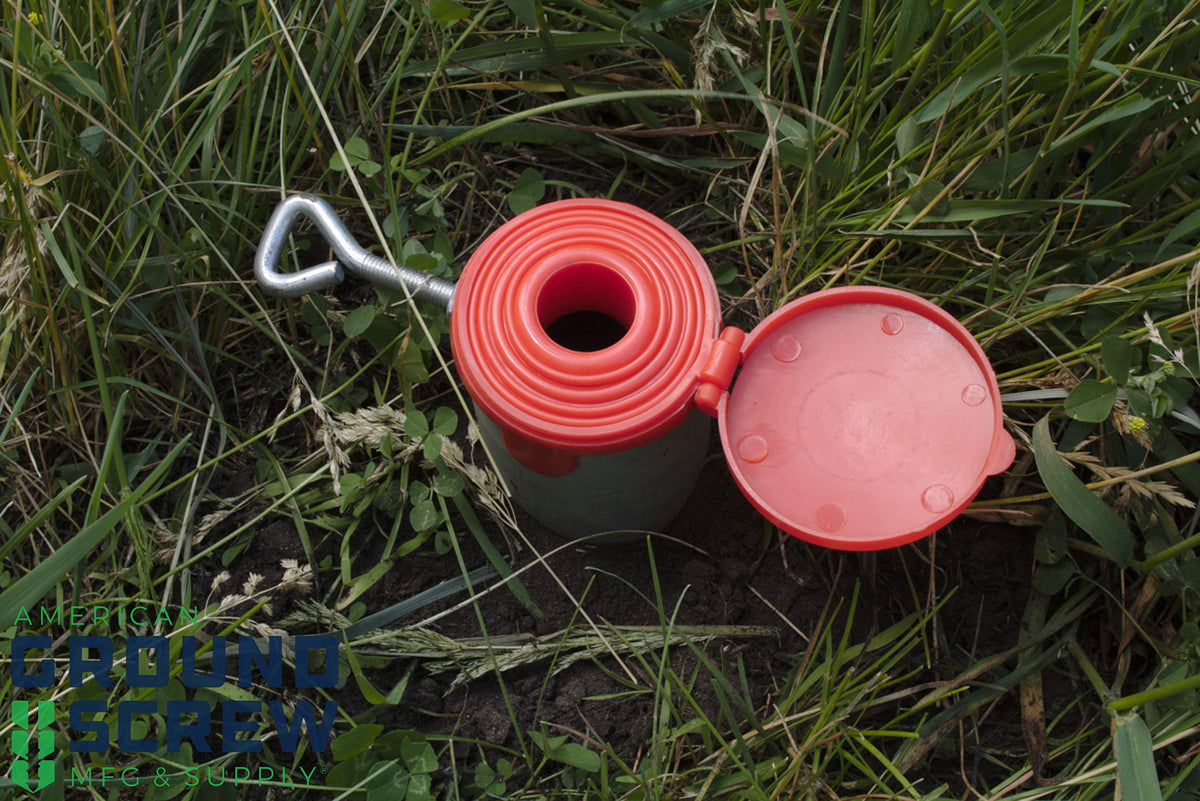 American Ground Screw Model 1 Cap pilot-hole setup assists drilling in hard soil.
