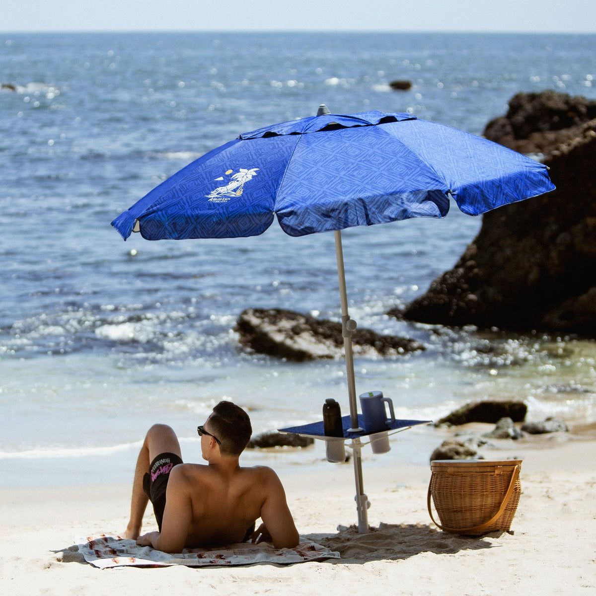 AMMSUN beach umbrella built-in table on a sunny day by the pool.