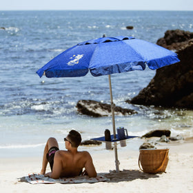AMMSUN beach umbrella built-in table on a sunny day by the pool.