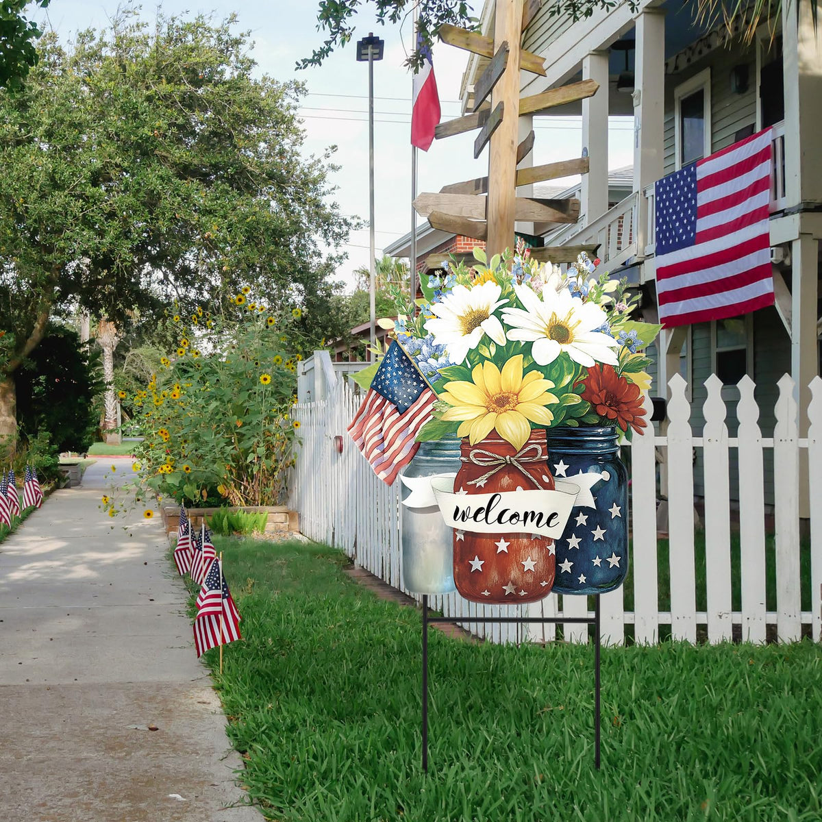 Amyhill 4th of July garden sign being placed in lush garden