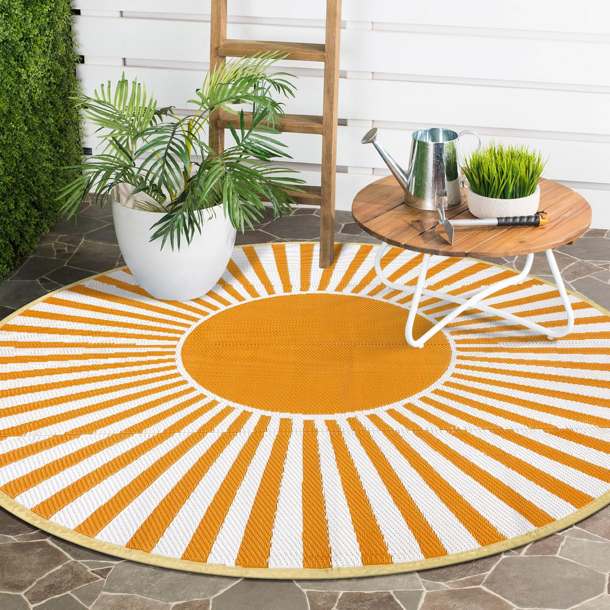 Anidaroel foldable rug with carry bag and stake loops for secure outdoor use.