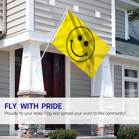 Two Anley yellow happy-face flags displayed on a porch for curb appeal