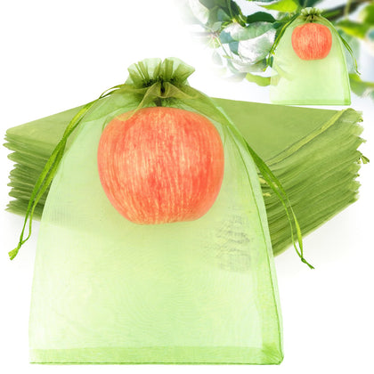 ANZNKU fruit protection bag over a tomato, guarding against pests.