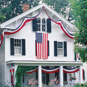 Aokansha large bunting drapes over a railing for Independence Day.