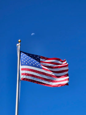 AOTAI flag displayed on a porch for patriotic curb appeal.