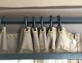 APEX GARDEN tan fabric trim close-up showing finished edge and blend with outdoors