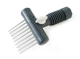 Aqua Comb spa filter cleaner tool in action removing debris from a cartridge.