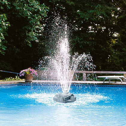Aqua Select grey rock floating pool fountain, enhances ambiance and cooling water.