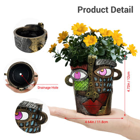 AquaLume hand-painted face pot enhances small plants with gallery-grade charm