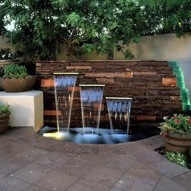 AquaMiracle 12-inch stainless steel spillway creates a smooth cascading flow.