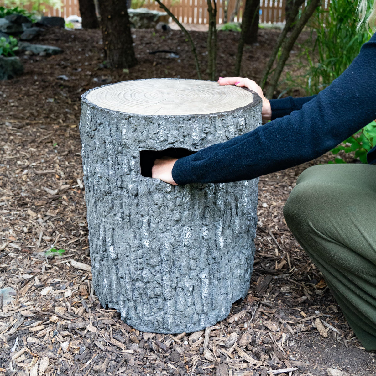 Aquascape faux wood stump propane tank cover with ventilation for safe, easy tank access.