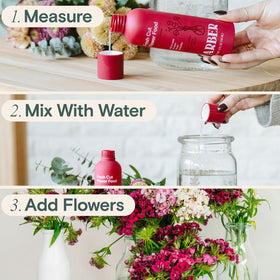 Close-up of ARBER 4 oz bottle with blooming roses ready for spray