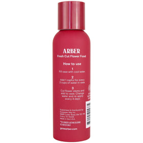 ARBER liquid flower food mix dissolving in clear vase water