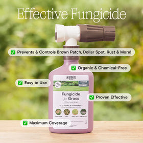 Hose-end spray action delivering fungicide on turf.