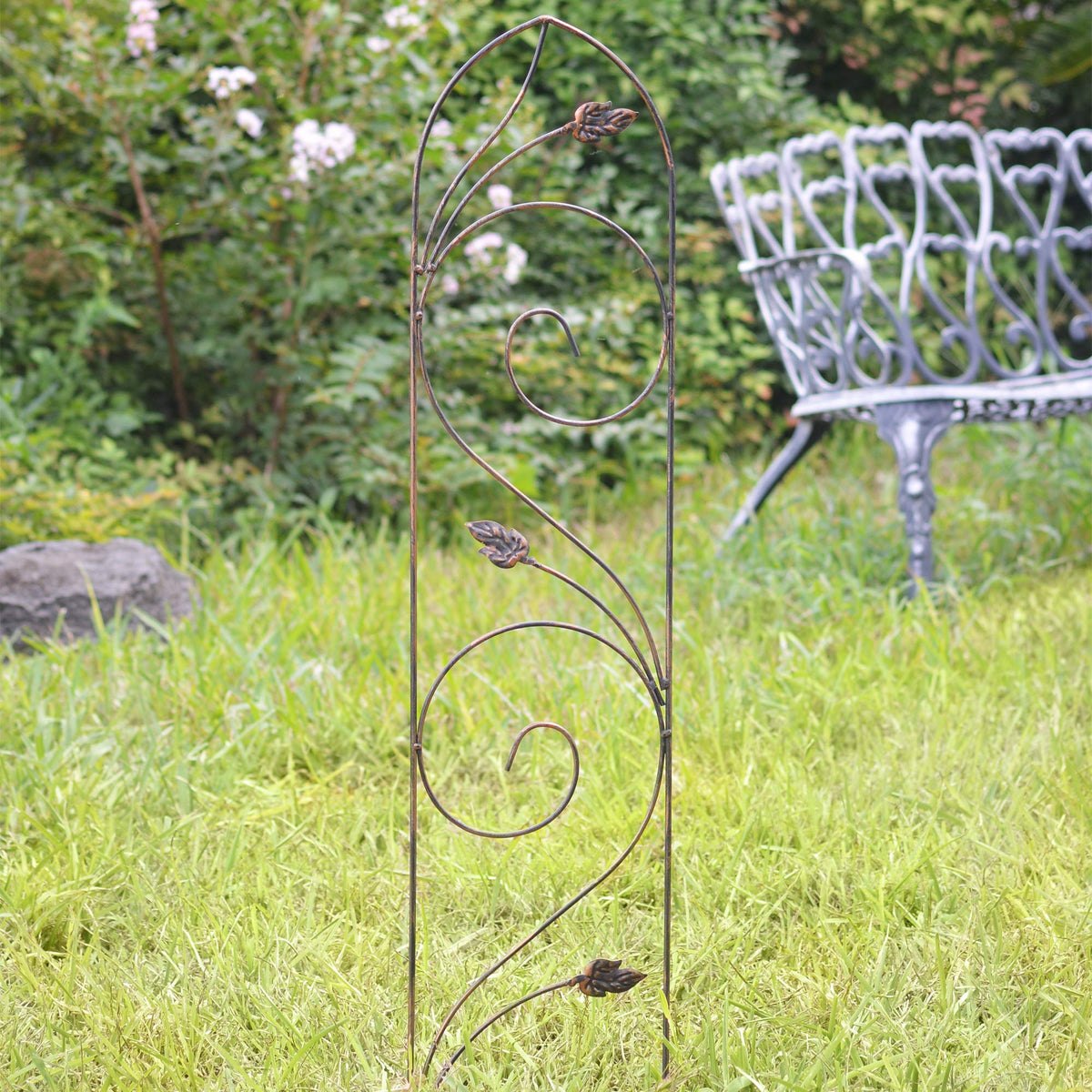 Close-up of bronze leaf scrolls on Arcadia TR04 decorative garden accent
