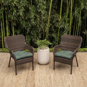 Arden earthFIBER cushion on wicker chair outdoors for easy, snug installation