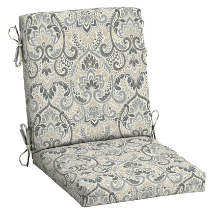 Arden Selections Aurora Damask chair cushion on a dining chair for comfortable outdoor meals.