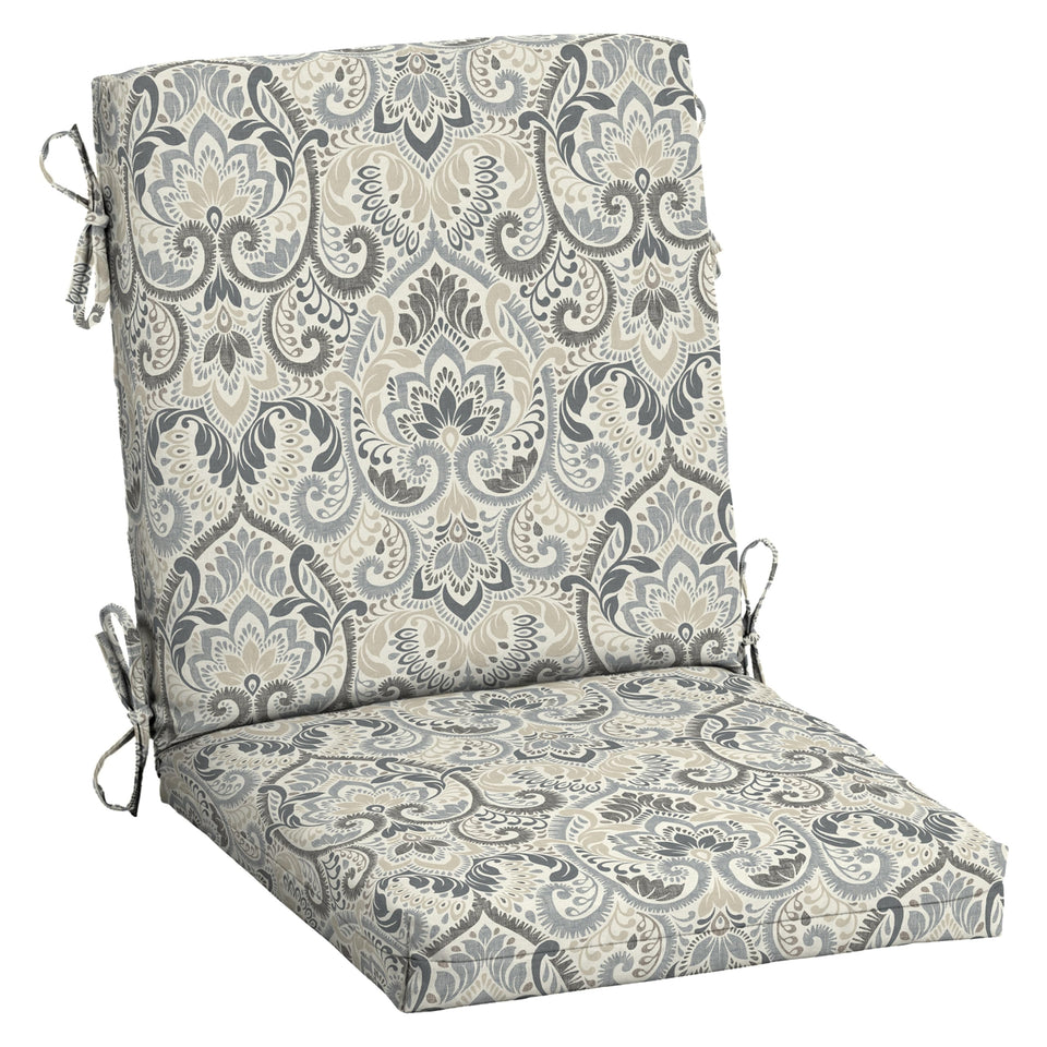 Arden Selections Aurora Damask chair cushion on a dining chair for comfortable outdoor meals.