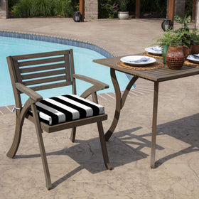 Arden Selections cushion on a rocking chair illustrates indoor-outdoor versatility.
