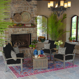 Arden Selections outdoor toss pillow stacked with others creates colorful, mix-and-match outdoor arrangements