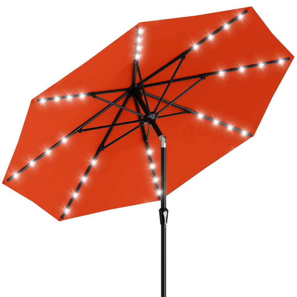AreShark 9ft patio umbrella with solar lights providing ambient illumination for outdoor gatherings.