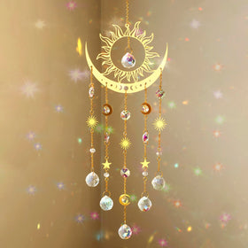 Artilady sun and moon suncatcher with crystal prisms casting rainbow light in sunny window