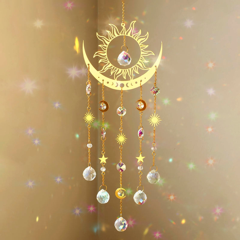 Artilady sun and moon suncatcher with crystal prisms casting rainbow light in sunny window